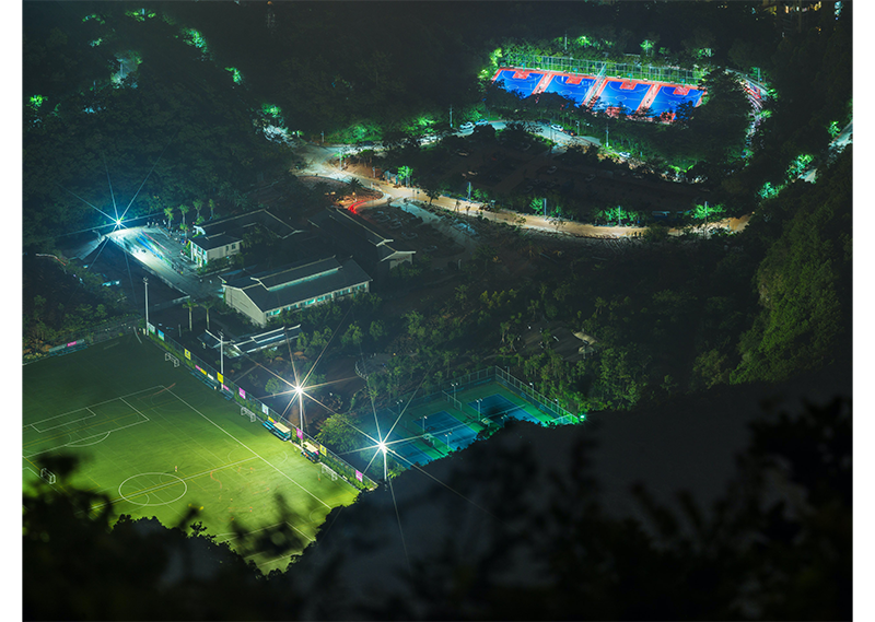Hasselblad X1D Sample Photos of sports fields at night surrounded by dense forrest